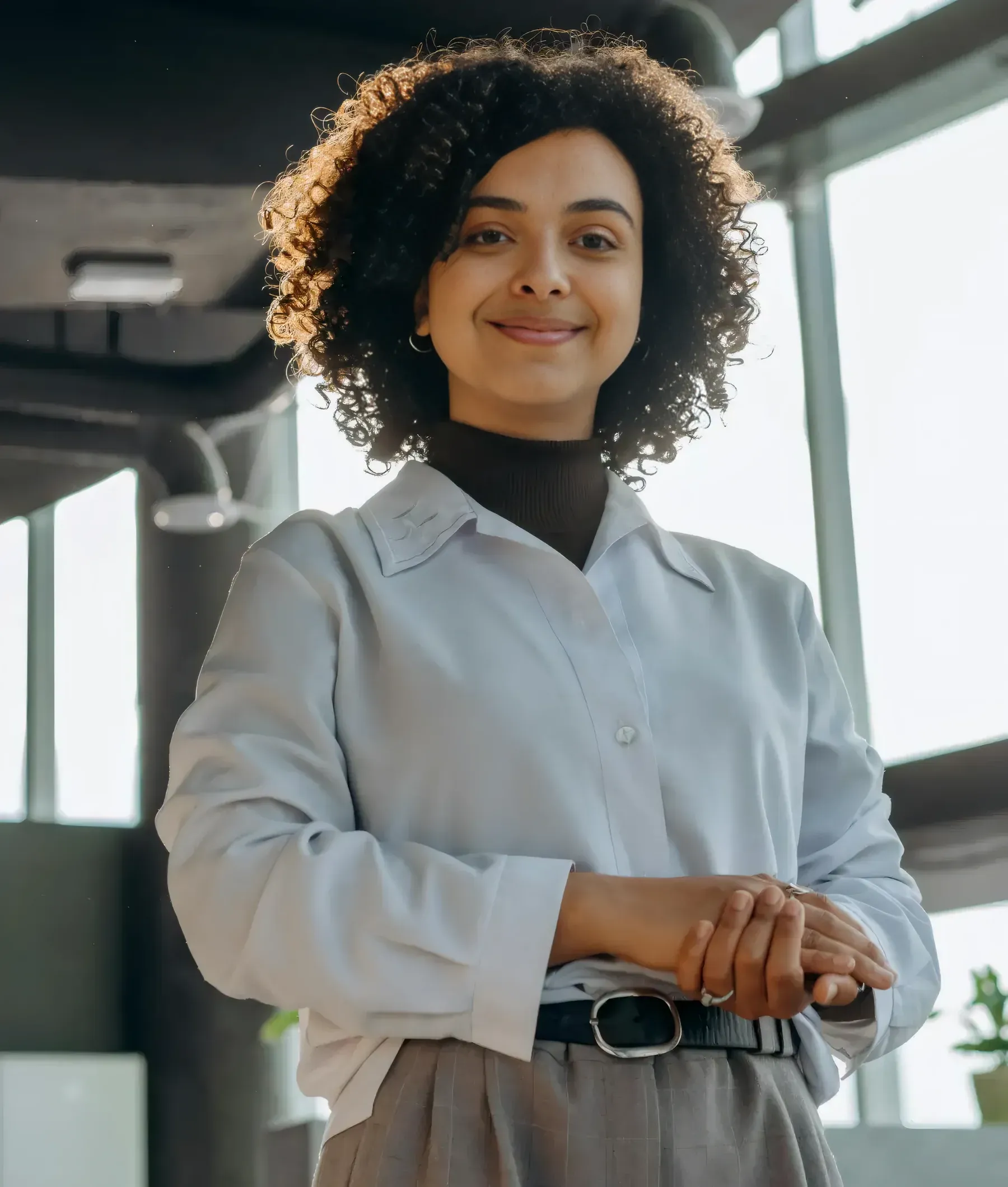 A confident professional standing in her office